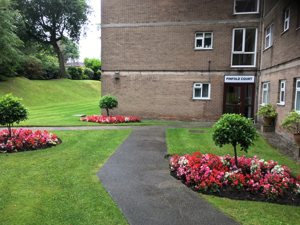 Grass turf maintenance and flower design done in Pinfold Court